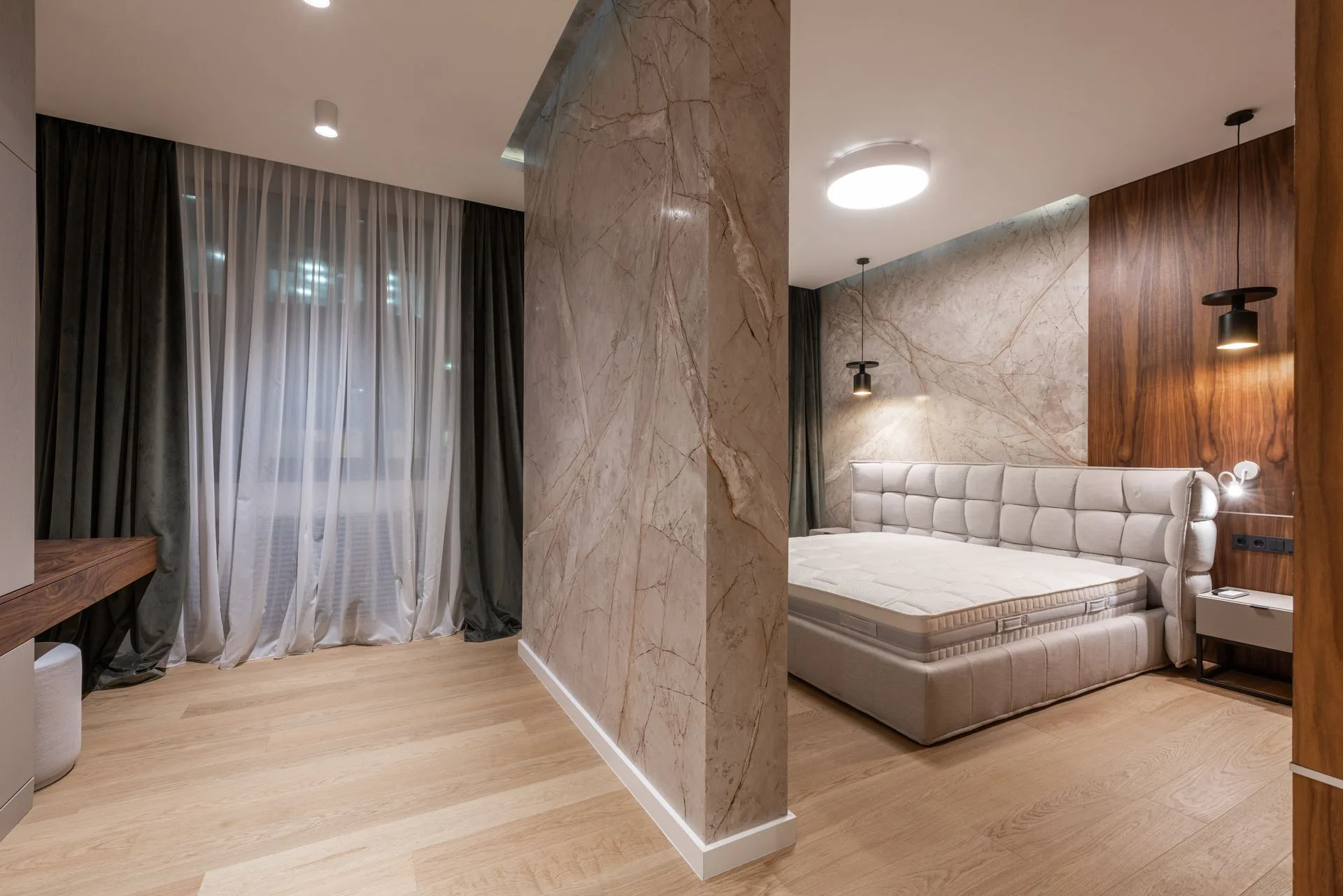 Bright modern bedroom with evening city light