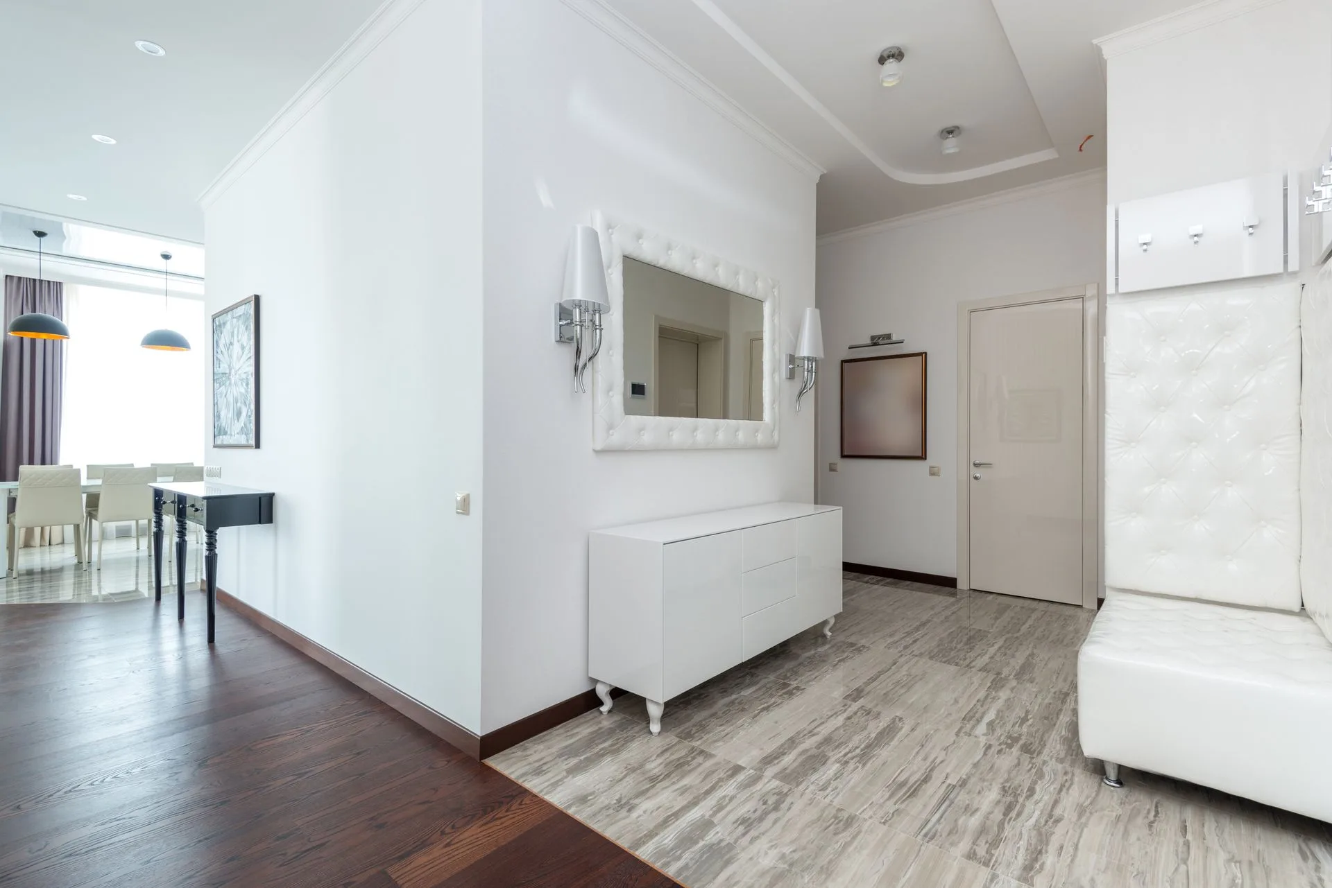 Minimalist white apartment interior with city outlook