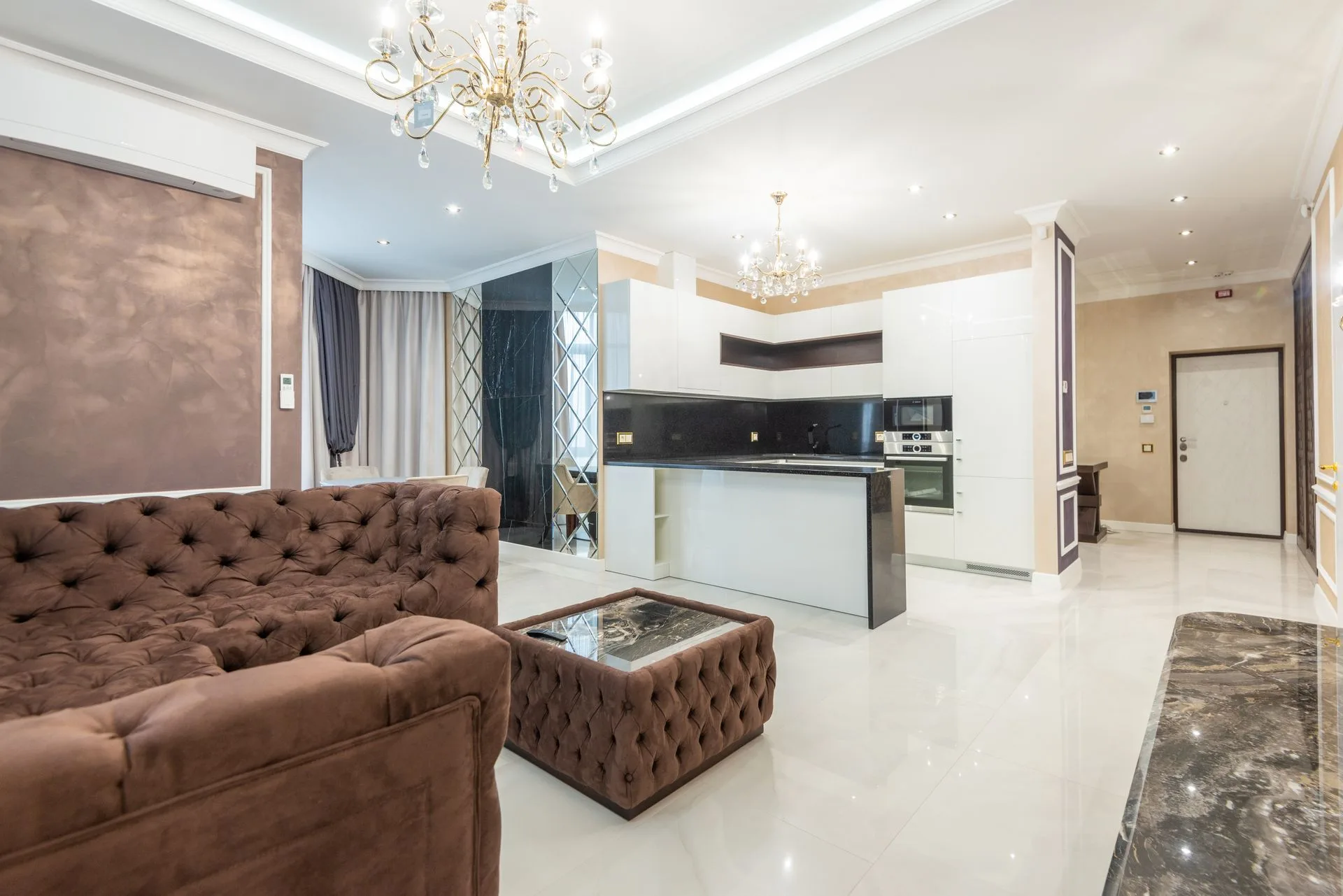 Open-plan apartment living area with floor-to-ceiling glazing